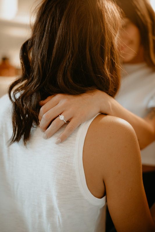 Candid photo of the couple laughing during their South Carolina engagement session