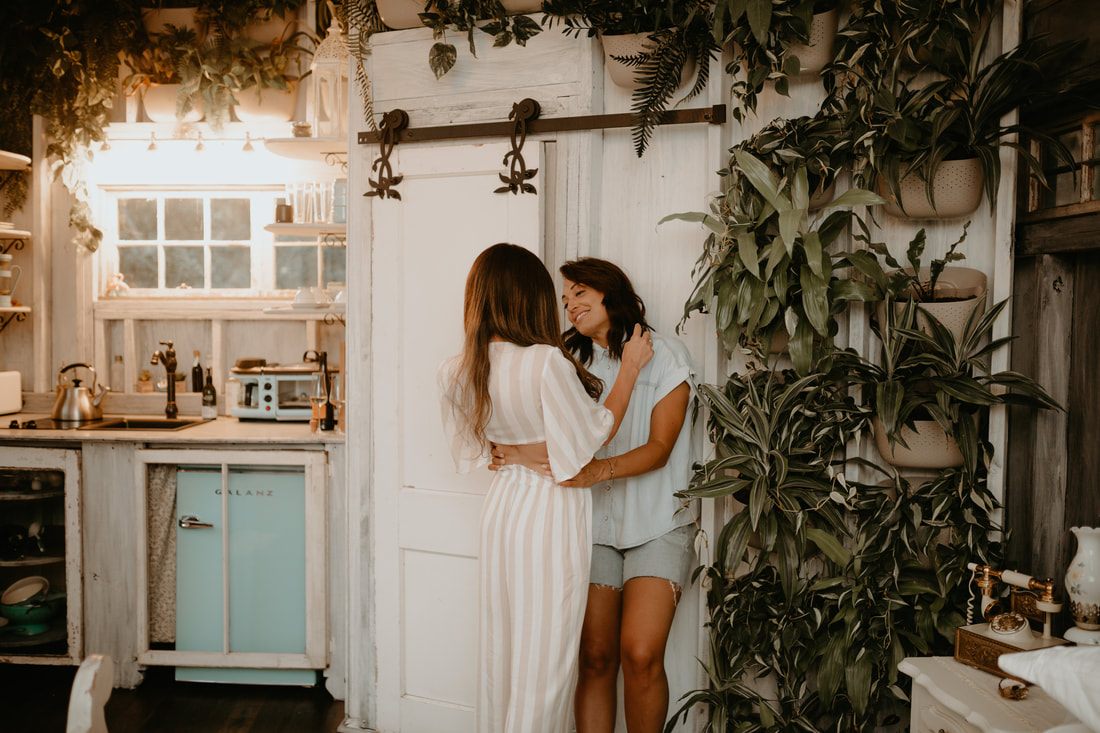 Intimate portrait of the newly engaged couple on the treehouse steps
