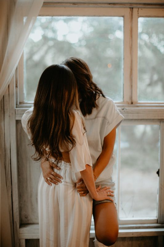 Francesca and Nicole cuddled up together inside the cozy treehouse