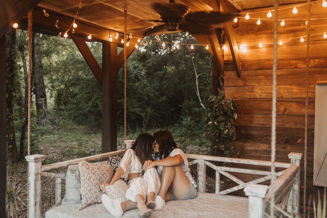 Francesca and Nicole sharing a quiet moment surrounded by trees
