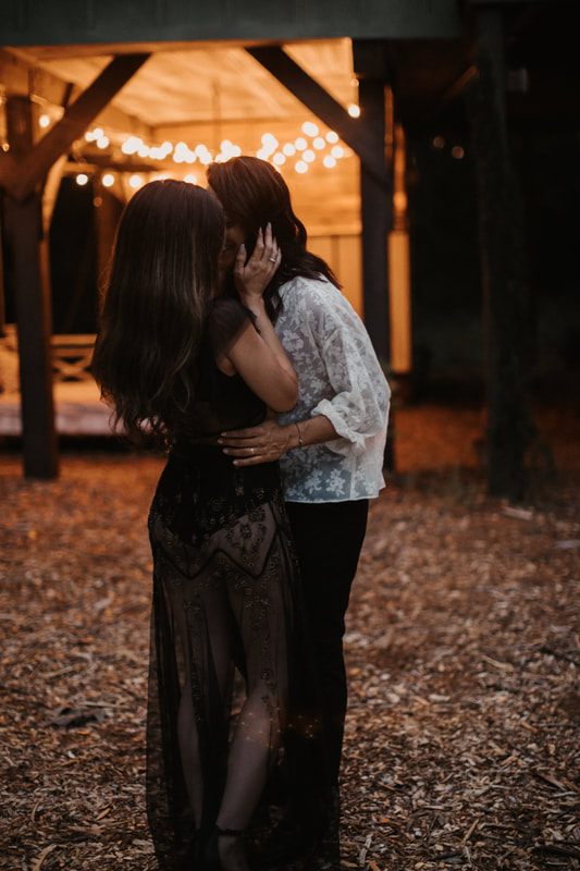 Close-up of the couple's intertwined hands during their Charleston engagement session