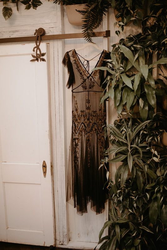 Francesca and Nicole embracing outside the whimsical Bolt Farm treehouse