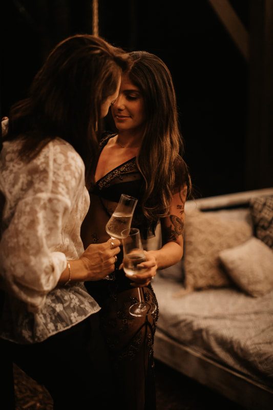 Francesca and Nicole holding hands, showing off the new engagement ring