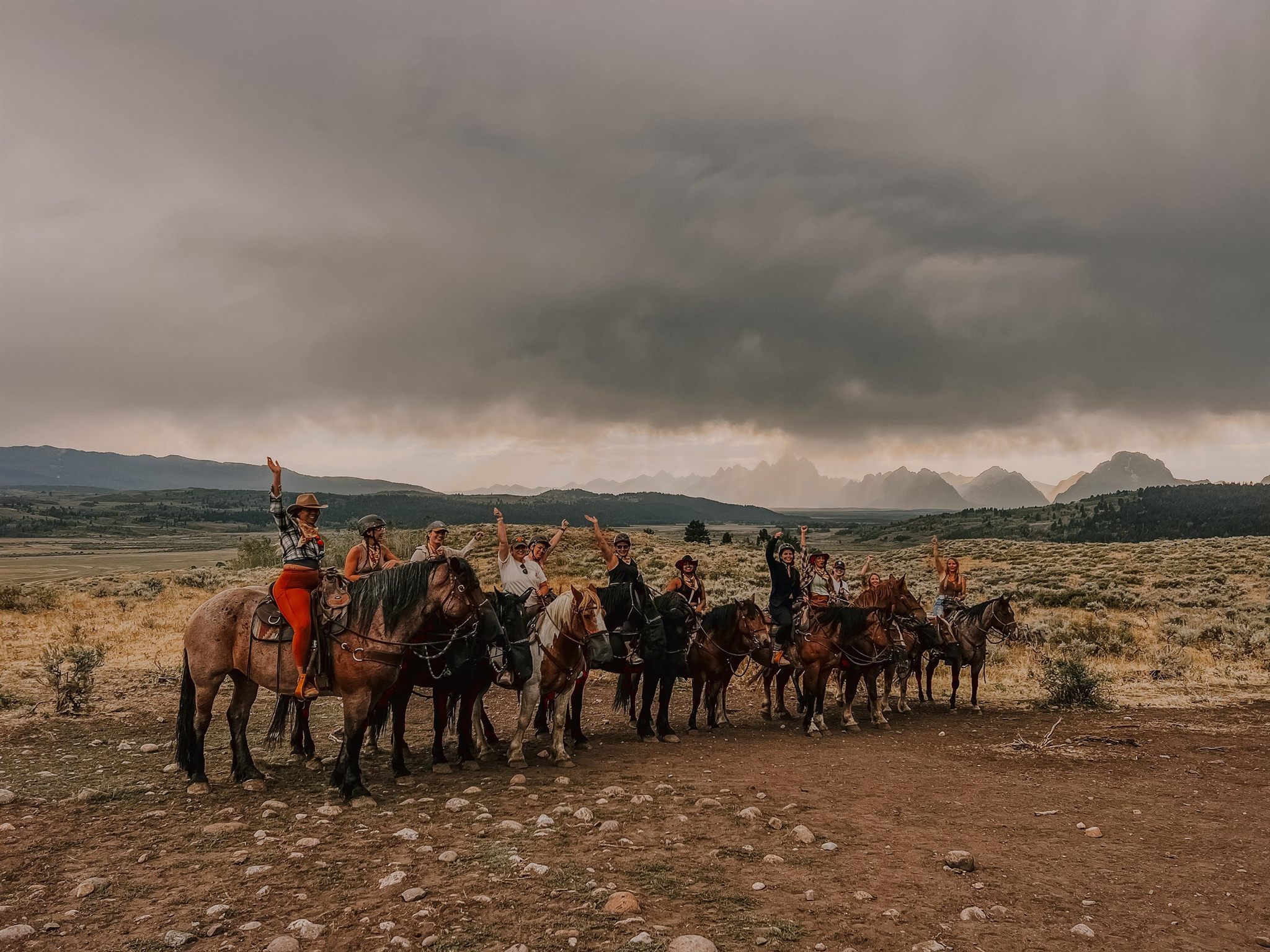 Women's retreat group riding horseback through the Grand Teton valley