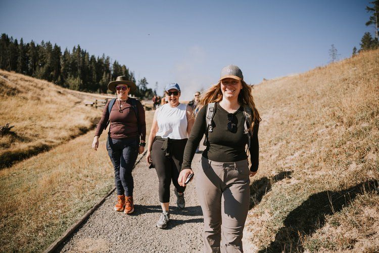 Women's retreat group riding horseback through the Grand Teton valley