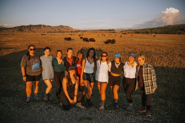 Women gathered outdoors at the Grand Tetons retreat