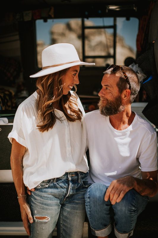 Close-up portrait of the couple embracing among the desert boulders