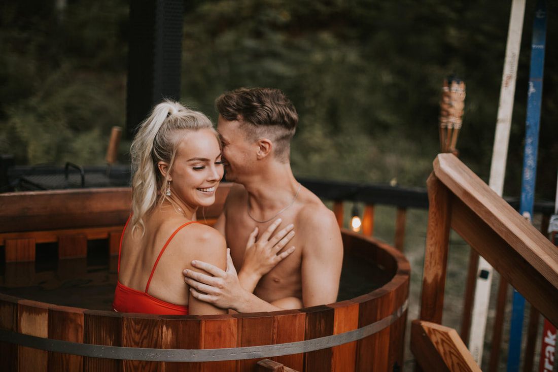 The couple sharing a quiet moment in the evening light at the cabin