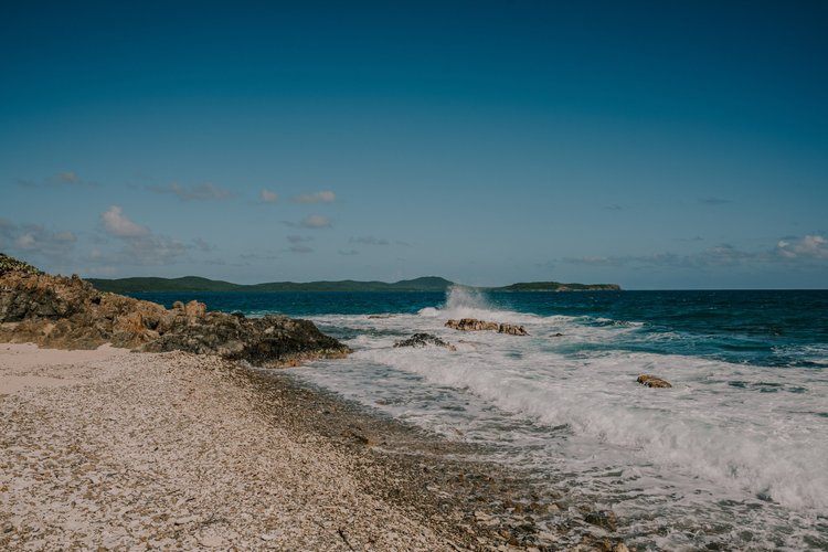 Golden sunset over the ocean in Vieques, Puerto Rico, by Lindsey O