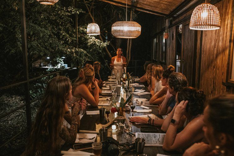 Retreat guests connecting and sharing stories in a women's circle