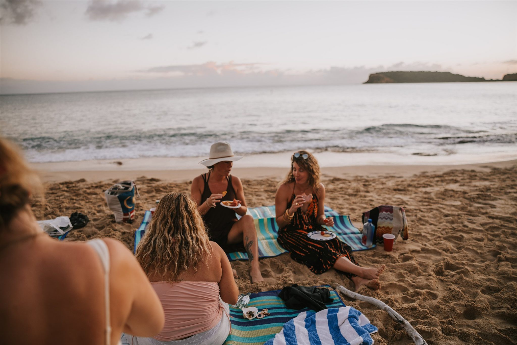 Retreat guests connecting and sharing stories in a women's circle
