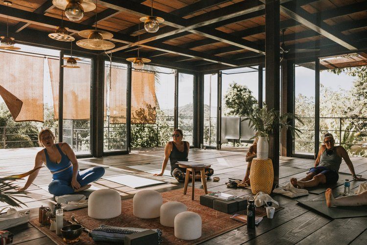 Retreat guests connecting and sharing stories in a women's circle