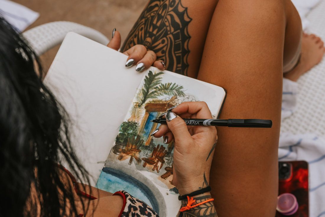 Retreat guest journaling during a quiet art and reflection circle