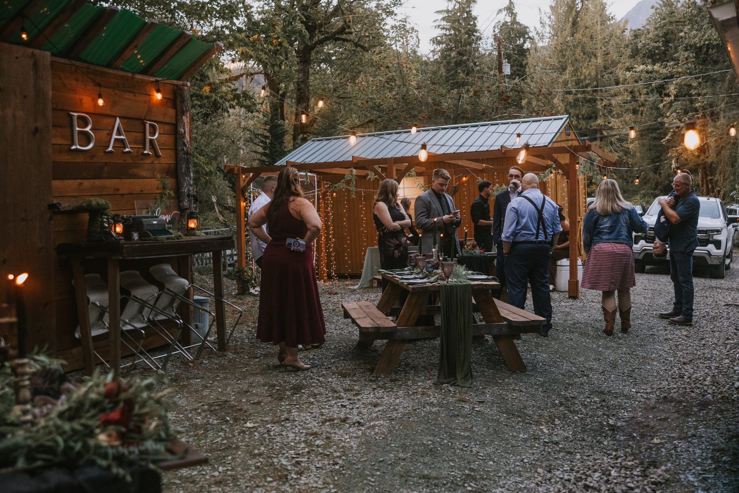 Guests gathered near the outdoor bar as the lights come on