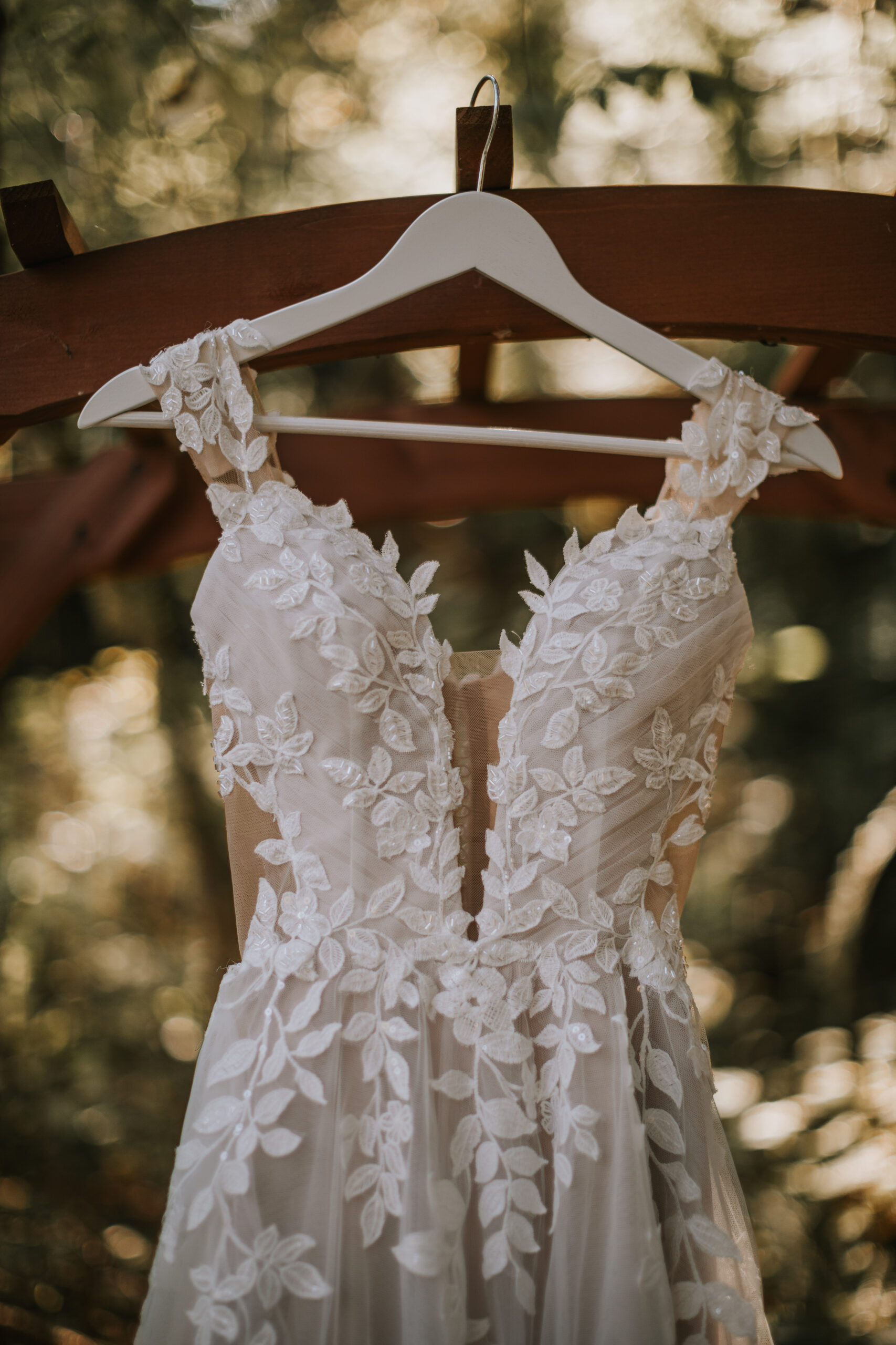 Close view of the lace leaf applique on the straps of Morgan's gown