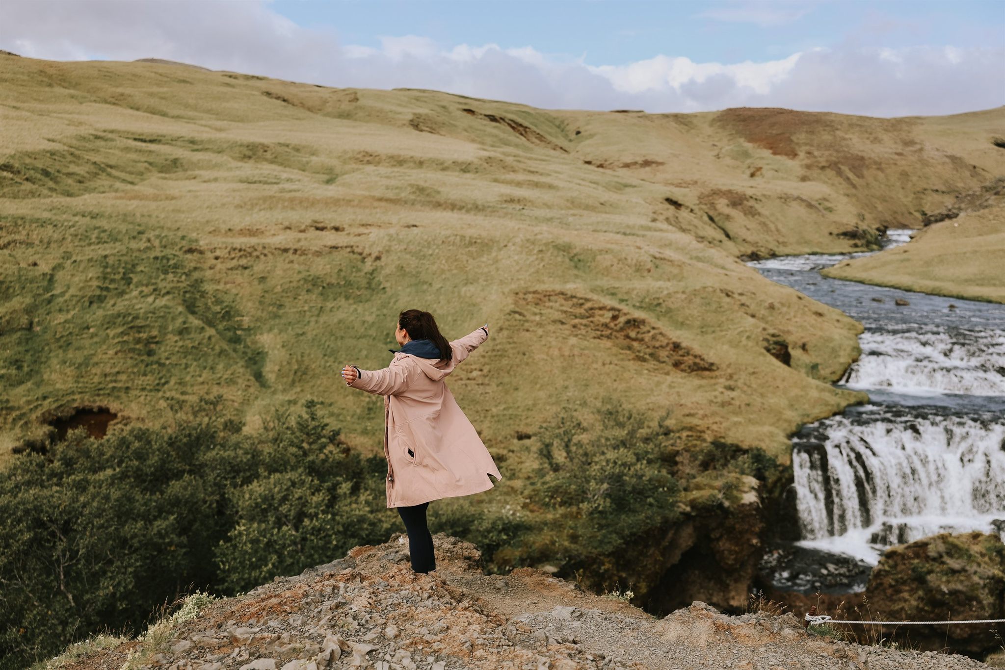 Iceland women's retreat group at a waterfall